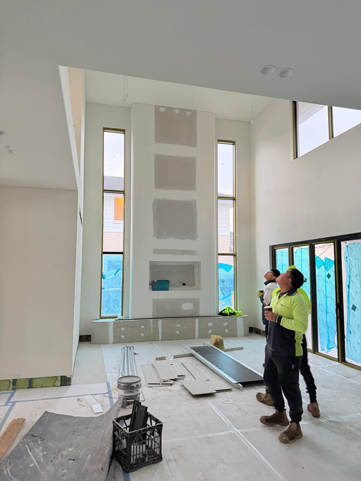 Our team fitting out a high-ceiling interior